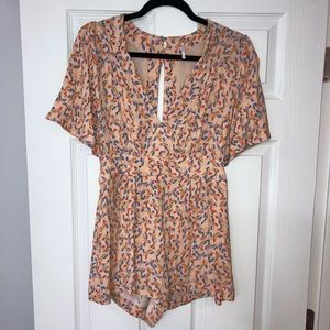 Free people light orange patterned backless romper